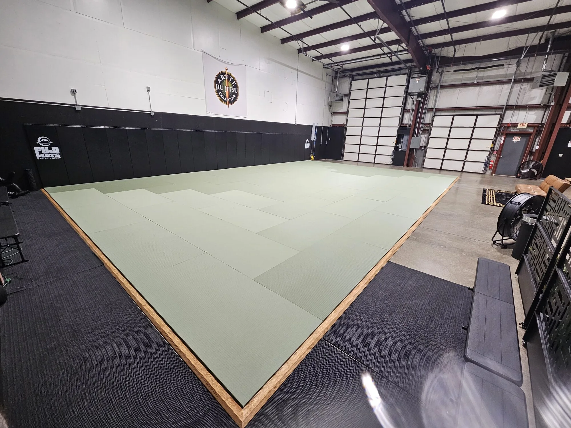 The Arete Jiu Jitsu Collective mat and academy floor